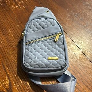 Slate blue with gold zippers. Almost new.  Barley used. Plus size crossbody